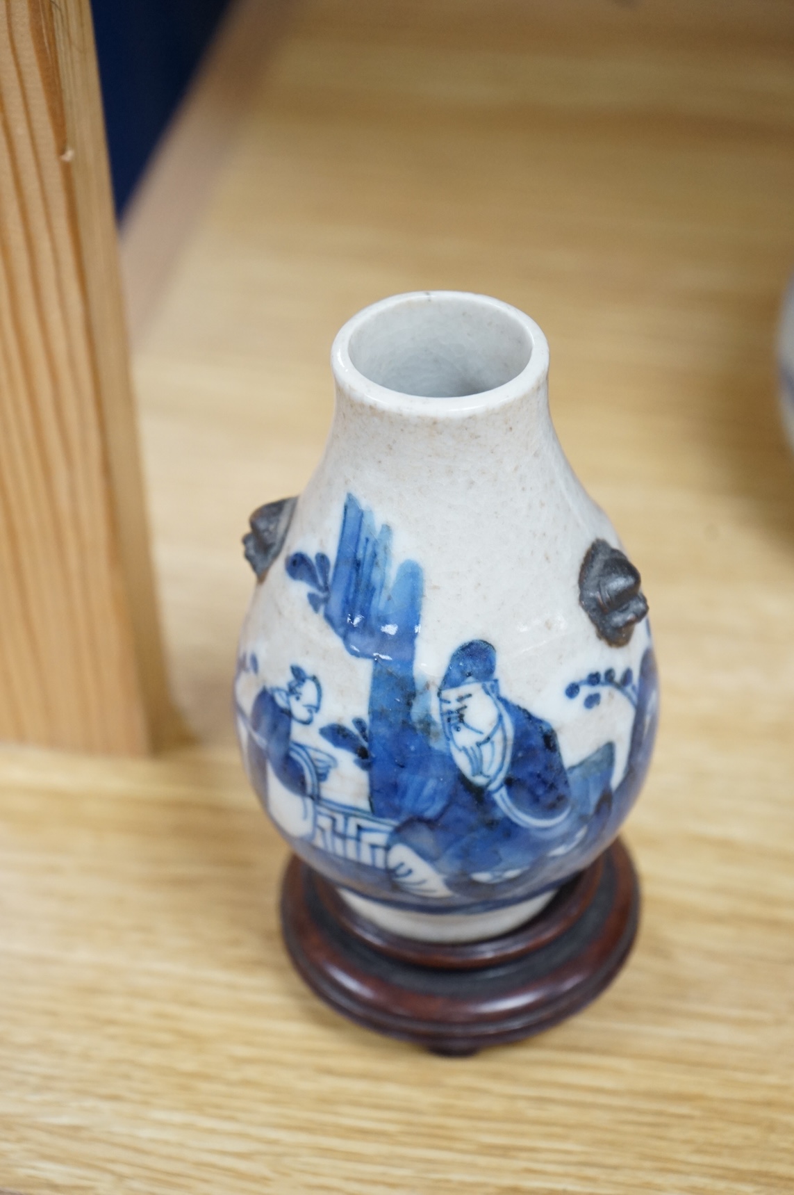 A Chinese blue and white bottle vase, a crackle glaze vase and a Tibetan copper and brass ‘monk’ cap’ ewer (3), tallest 21cm